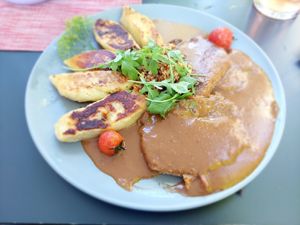 Vegan seitan steak with potato patties and roasted onions at Gasthaus Kappl in Biberbach