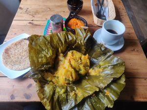 Breakfast tamale with empanada and coffee. at Nativa in Bogota