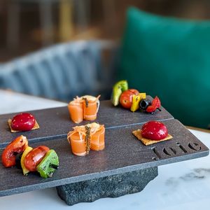 Chef's Selection of Assorted Platter: Salmon sashimi with sea grapes, vegetable skewer, raspberry burst on biscuit  at Joie Restaurant in Central Singapore