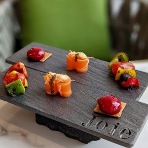 Chef's Selection of Assorted Platter: Salmon sashimi with sea grapes, vegetable skewer, raspberry burst on biscuit  at Joie Restaurant in Central Singapore