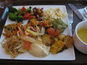 Selection of cold and warm dishes. Soup on a separate bowl on the left. at Vaxt Cafe in Stockholm