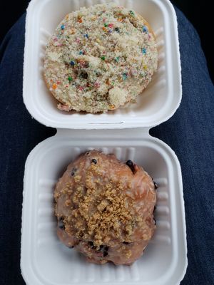 Top: birthday cake. Bottom: blueberry maple fritter. In compostable packaging! at Beechwood Doughnuts in St Catharines