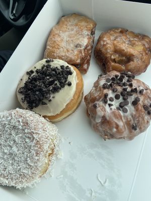 Coconut cream, dutchie, apple fritter, banana chocolate fritter & cookies ‘nd cream   at Beechwood Doughnuts in St Catharines