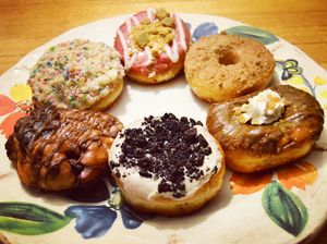 In clockwise order from the top: raspberry white chocolate cheesecake, French toast, salted caramel mocha, cookies and cream (my personal favorite!), cherry chocolate fritter, and birthday cake. Photo taken February 2018. at Beechwood Doughnuts in St Catharines