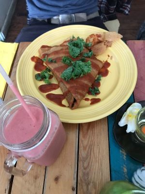 Jacked up crêpes with smoky pulled jackfruit, caramelized onions, roasted red pepper, kale and homemade BBQ sause at Little ChoC Apothecary in Brooklyn