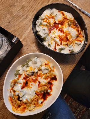 Vegan mantı with tomato sauce, soy and garlic yogurt at Lezizel Manti in Munich