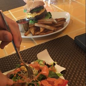 salad and veggie burger  at Violette's Vegan Organic Cafe and Juice Bar in Las Vegas