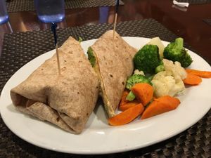 Hummus wrap and side steamed veggies  at Violette's Vegan Organic Cafe and Juice Bar in Las Vegas
