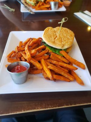 Californian dreamin bacon cheeseburger with sweet potato fries  at Violette's Vegan Organic Cafe and Juice Bar in Las Vegas