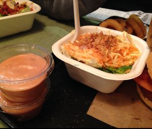 Coleslaw, onion rings and barbecue sauce at Swing Kitchen - Schottenfeldgasse in Vienna