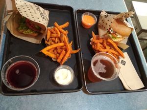 BBQ EDGY (left) and Vienna Burger (right) with sweet potato fries, soft drinks, and dips (lemon-mayo and hot chili), as served in November 2019. at Swing Kitchen - Schottenfeldgasse in Vienna