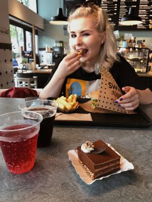 My sister enjoying Vienna burger at Swing Kitchen - Schottenfeldgasse in Vienna
