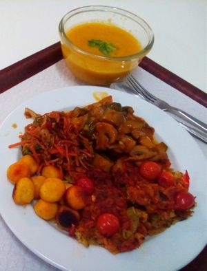 Flavorful Pizza-like-filling dish with Asian salad and small baked potatoes at Sociedade Portuguesa de Naturalogia in Lisbon