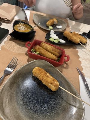 Tofu satay skewers, spring roll  at Gran Familia in Tenerife