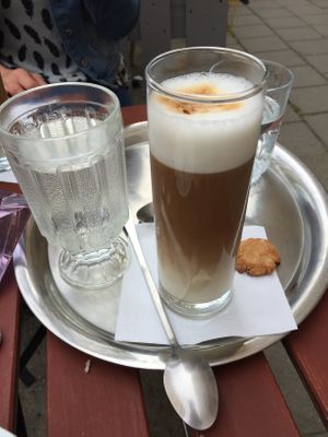 oat latte served in glass at Cukrárna in Brno