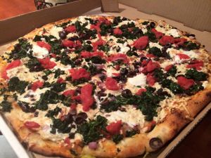 Vegan Athen pizza with crushed tomatoes, arugula, kalamata olives, spinach, and red onions.  at Vannucchi Brothers in Hollywood