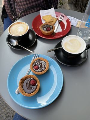 Cappuccino with soy milk and almond-rice milk, tortina with chocolate and raspberry filling at Bar Pasticceria Rovida in Milan