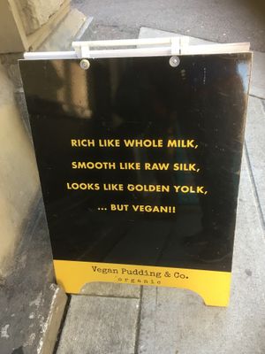 Signage at Sai Plant Deli by Vegan Pudding & Co. in Vancouver