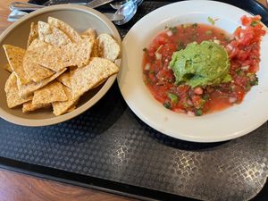 Guac plate with bottomless chips at Aqui in Campbell