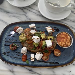 Vegan Bruschetta with added vegan feta and beans on the side   at Kitch in Canterbury