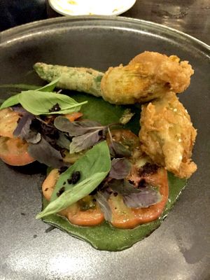 Zucchini flowers!  Crumbed zucchini flowers filled with cashew ‘cheese’ | Victorian heirloom tomatoes | dried black olives green gazpacho dressing at Matteo's in Fitzroy North