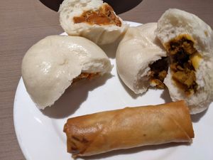 Bbq buns, curry buns, spring rolls (this is half of each) at Zen Gardens in London