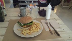 their quinoa burger + lemoniada which is always given +amazing garlic dressing at Punto Vegano in Madrid