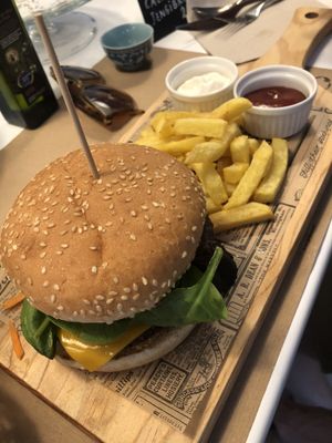 Fresh made quinoa burger, chips with aioli and ketchup at Punto Vegano in Madrid