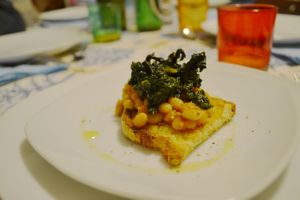 Home made bread crostino, zolfini beans, black cabbage at Spezialita Chef a Domicilio Roma in Rome