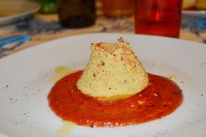 Chickpea flan, tomato and rosemary sauce, orange and beetroot crumbs at Spezialita Chef a Domicilio Roma in Rome