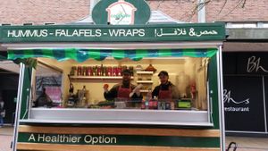 Friendly staff at the food stall. at Hummus House UK in Coventry
