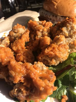 Buffalo cauliflower bites!  Oh my gosh!, They’re the best I’ve ever had and I’ve tried making these for years.  at Dory Deli in Newport Beach