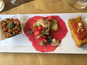 Farro salad, celeriac carpaccio, tofu with laurel and cream of almonds and hazelnuts at Casa Scaparone in Alba