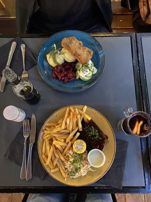Ribs and the soy schnitzel with potatoes and beetroot  and mulled wine  at Lokal Vegan Bistro in Warsaw