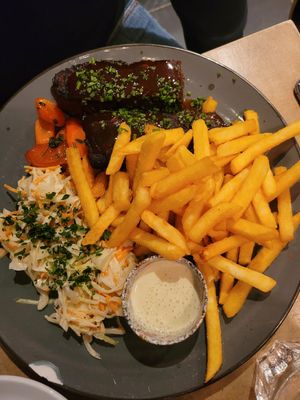 fries, cabbage salad and delicious vegan meat with gravy sauce at Lokal Vegan Bistro in Warsaw