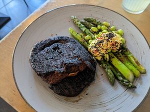 Seitan steak and asparagus at Lokal Vegan Bistro in Warsaw
