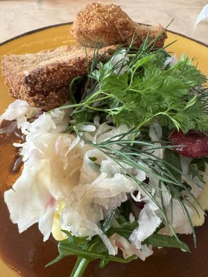 Topped with mash and sauerkraut and dill  at Lokal Vegan Bistro in Warsaw