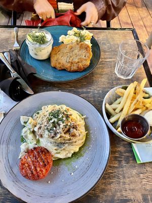 vegan carbonara and cutlet with potatoes + cucumber saladd  at Lokal Vegan Bistro in Warsaw