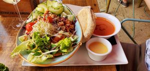 Salad set lunch meal, with gazpacho and bread. at VIVA in Madrid