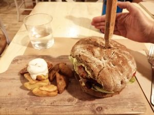 Garden burger with a hand for perspective at VIVA in Madrid
