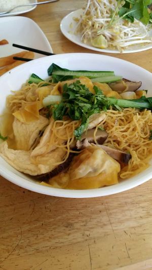 Fried wanton noodle soup with tofu and beans. Side of bean sprouts and mint which can be added at Tan Duy Linh in Cabramatta