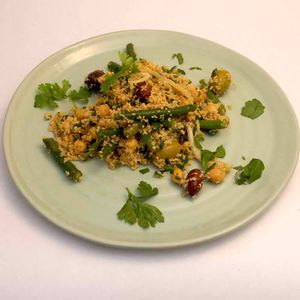 Mediterranean Couscous & Bean Salad. Fresh herbs & spices tossed through couscous with beans, chickpeas & olives. A nutritious & complete salad. Vegan at Scarecrow in Auckland