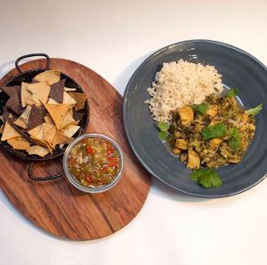 Chickpea Chilli Verde. Chickpeas & wilted kale in a spicy Mexican base accompanied by brown rice; green tomatillo Salsa &Toto Pitos. Vegan. at Scarecrow in Auckland
