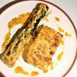 Gratin Dauphinois & Braised Leek. Braised leek dressed with a honey mustard sauce and walnuts - accompanied by a classic French dish of Gratin Dauphinois. Vegetarian. at Scarecrow in Auckland