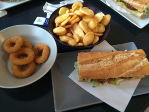 Onion rings, fries and burguer sandwich. All vegan.  at Pentagrama in Cerdanyola Del Valles
