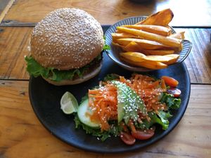 Lentil Burger with sweet potato fries and side salad 🥗 amazing! at La Colmena in San Andres Cholula