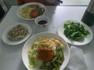 Two com dia, spring rolls and fried cabbage  at Thien Phu in Hue
