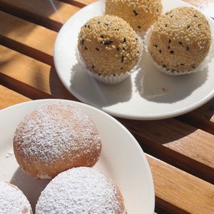 Passion fruit donuts & Black sesame balls  at Bodhi in Sydney