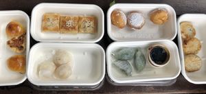 Curry puffs, prawn dumplings, bbq squares, spinach dumplings, passion fruit custard donuts + duck dumplings  at Bodhi in Sydney