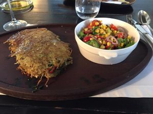 vegan potato fries with spinach and tomato inside and burnt corn salad at Garzon Restaurant in Garzon